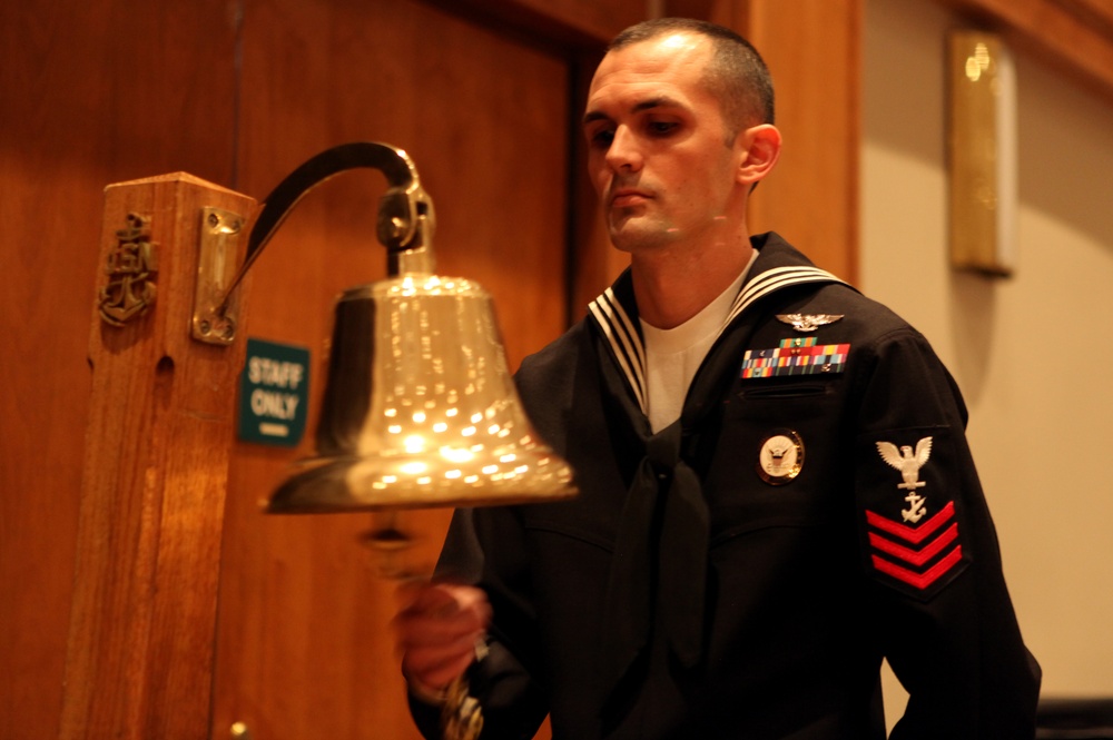 A sailor rings the bell