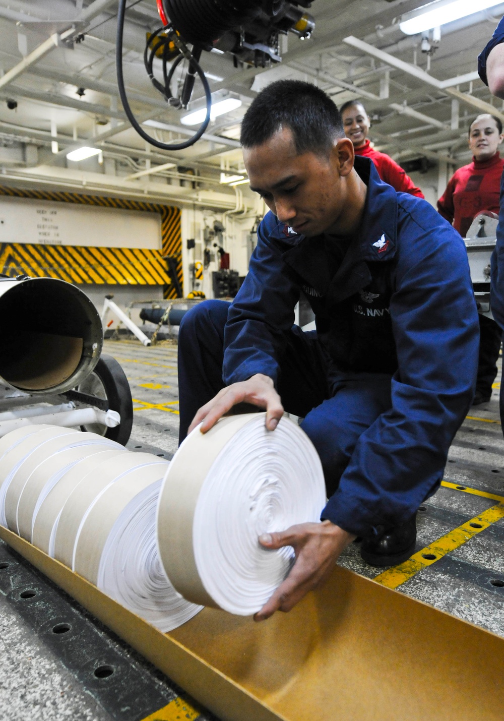 USS Nimitz sailor at work