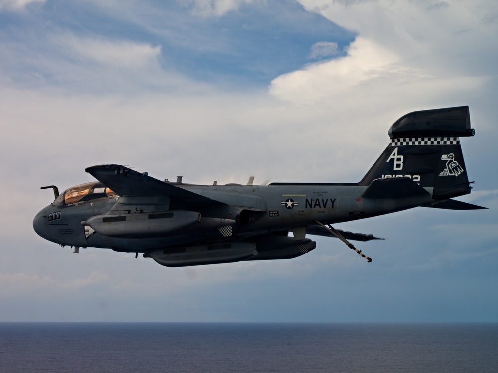 EA-6B Prowler flies over the USS Enterprise