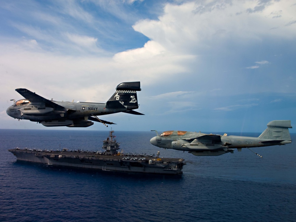 EA-6B Prowlers fly in formation over the USS Enterprise