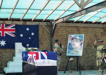 Tarin Kot bids farewell to a fallen comrade