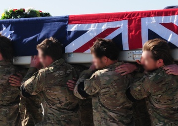 Tarin Kot bids farewell to a fallen comrade