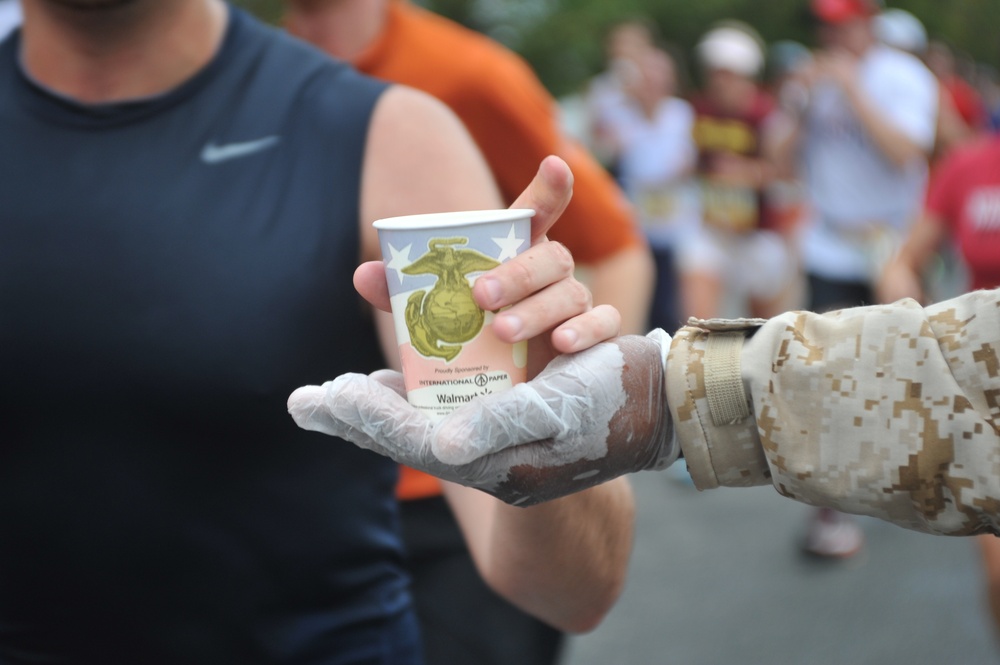 Marines give cups of motivation to runners