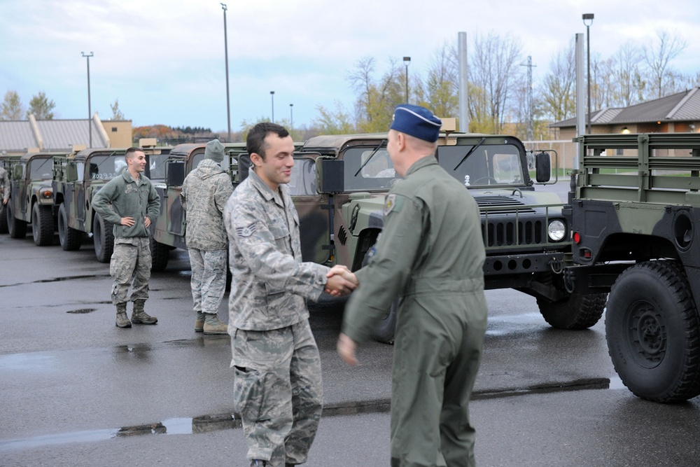 National Guard Airmen shuttle Army National Guard Humvees