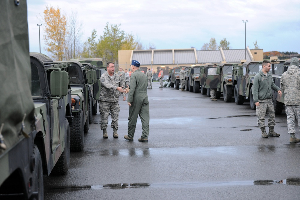 National Guard Airmen shuttle Army National Guard Humvees