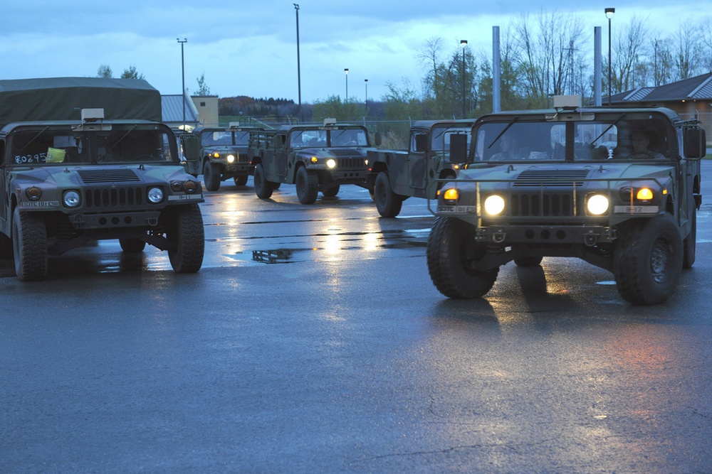 National Guard Airmen shuttle Army National Guard Humvees