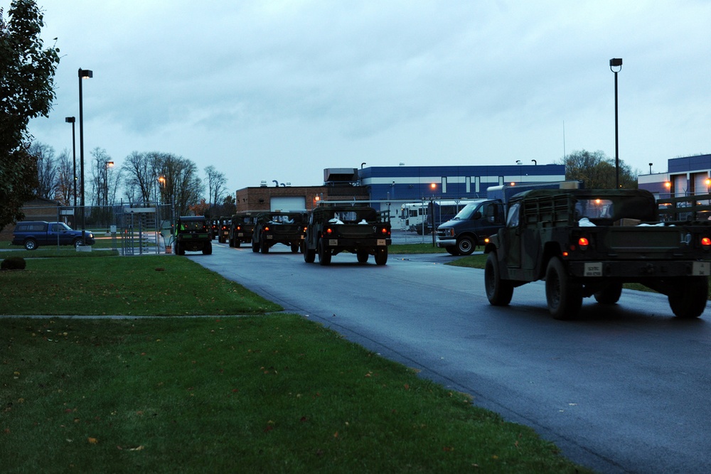 National Guard Airmen shuttle Army National Guard Humvees