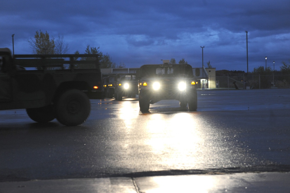 National Guard Airmen shuttle Army National Guard Humvees