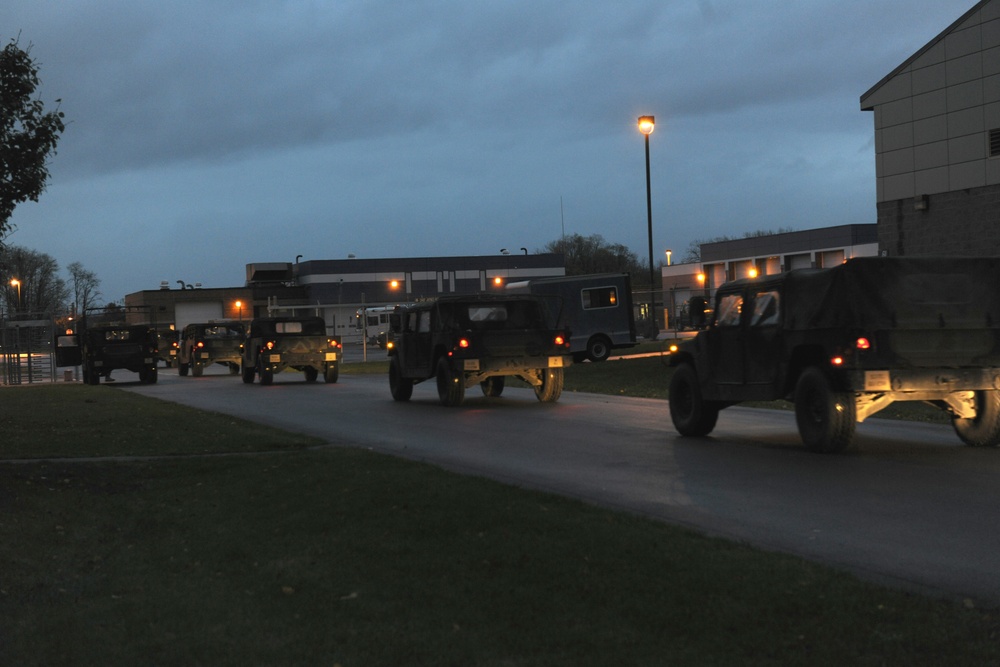 National Guard Airmen shuttle Army National Guard Humvees