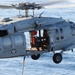 Helicopter carries cargo between ships