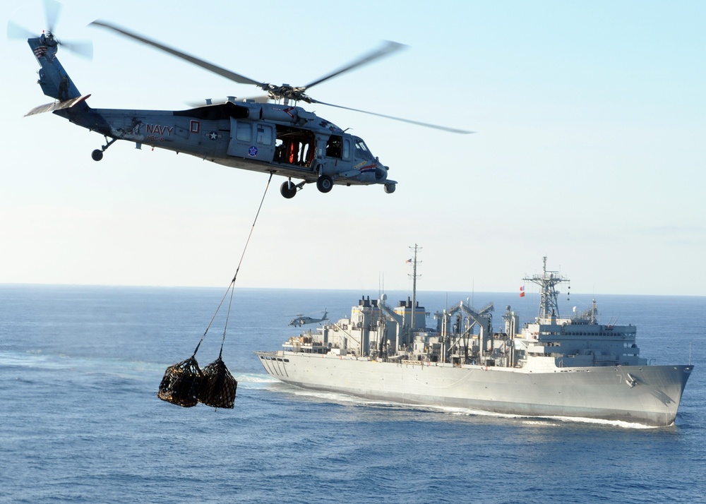 Helicopter carries cargo between ships