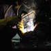 Sailor welds seam aboard USS Curtis Wilbur