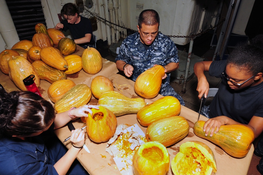 USS Dwight D. Eisenhower sailors carve pumpkins