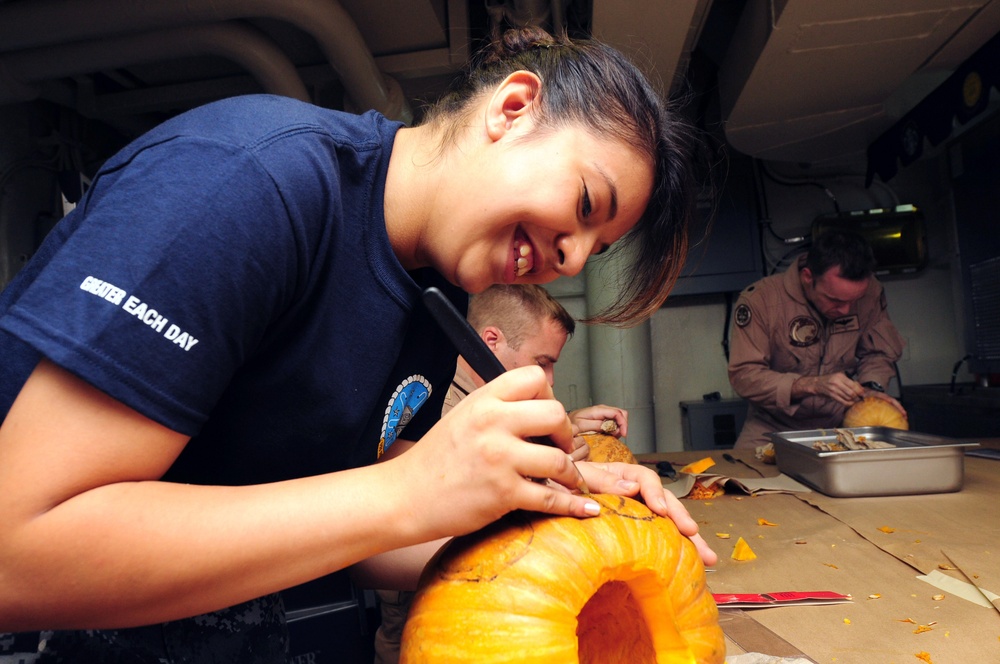 USS Dwight D. Eisenhower sailors carve pumpkins