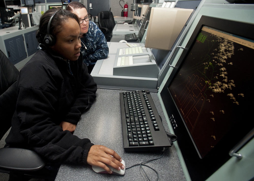 Air traffic controllers monitor from new watch floor