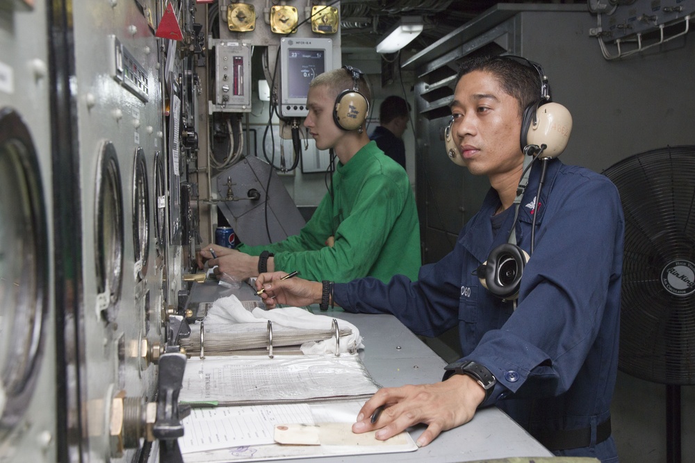 USS George Washington sailors monitor communications, catapult