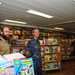 USS Emory S. Land CO visits MV Logos Hope book store