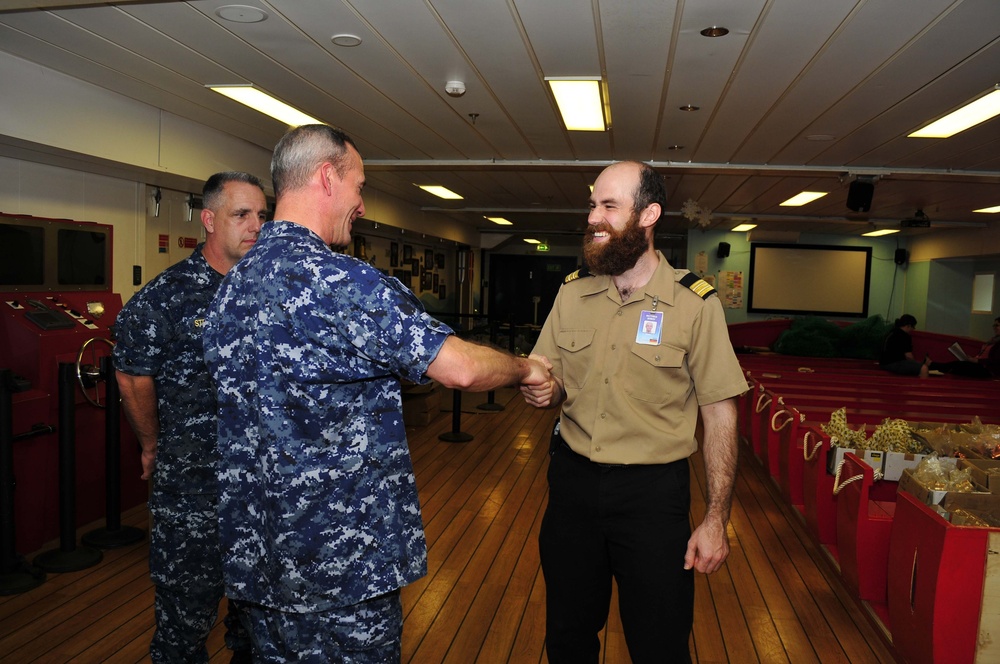 USS Emory S. Land CO visits MV Logos Hope book store