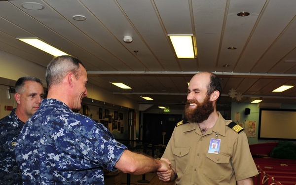 USS Emory S. Land CO visits MV Logos Hope book store