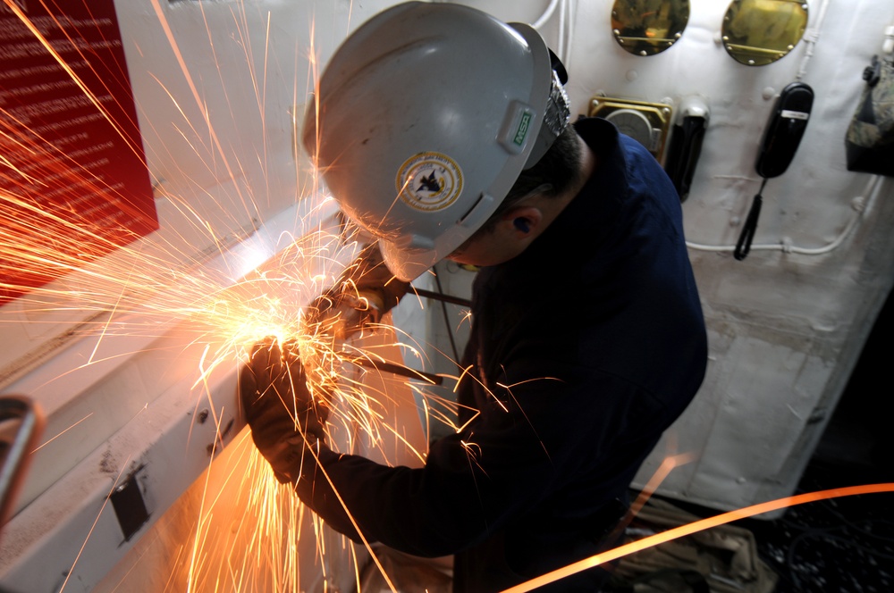 Sailor performs maintenance aboard USS Carl Vinson