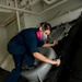 USS John C. Stennis sailor paints a bulkhead