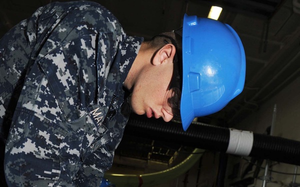 USS George H.W. Bush sailors at work