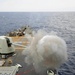 Gun fired aboard USS Mustin