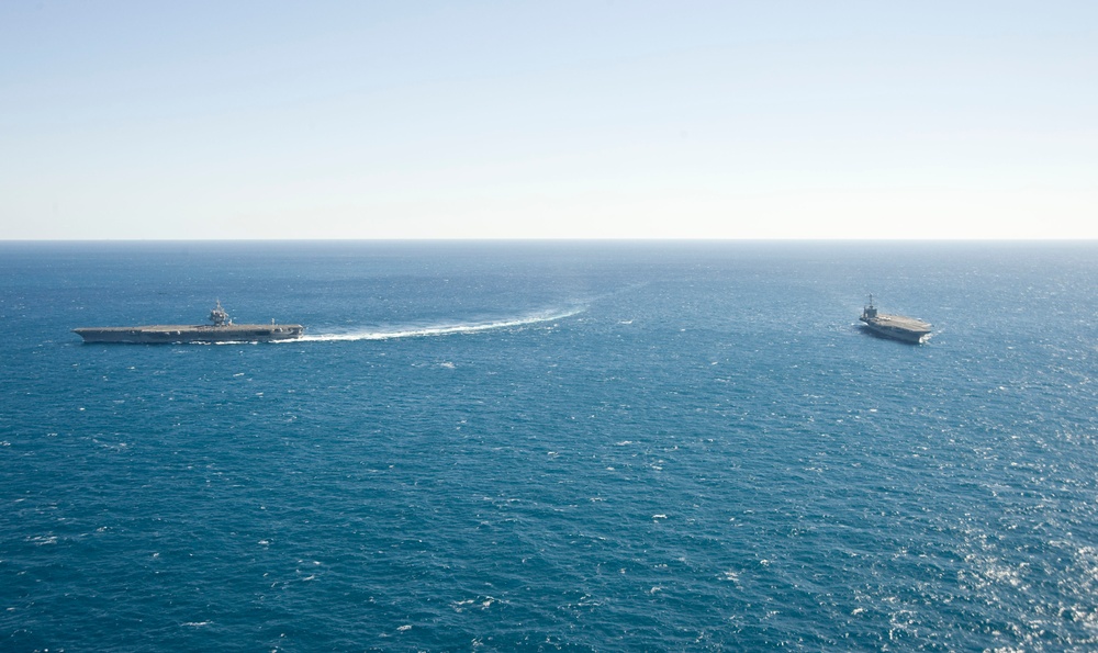 USS Enterprise passes USS Harry S. Truman in the Atlantic