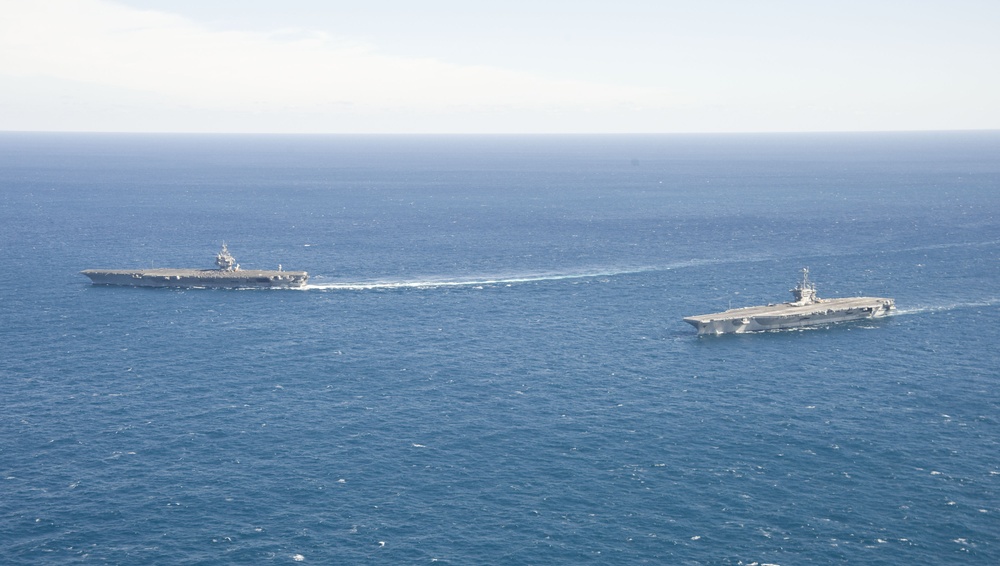 USS Enterprise passes USS Harry S. Truman in the Atlantic