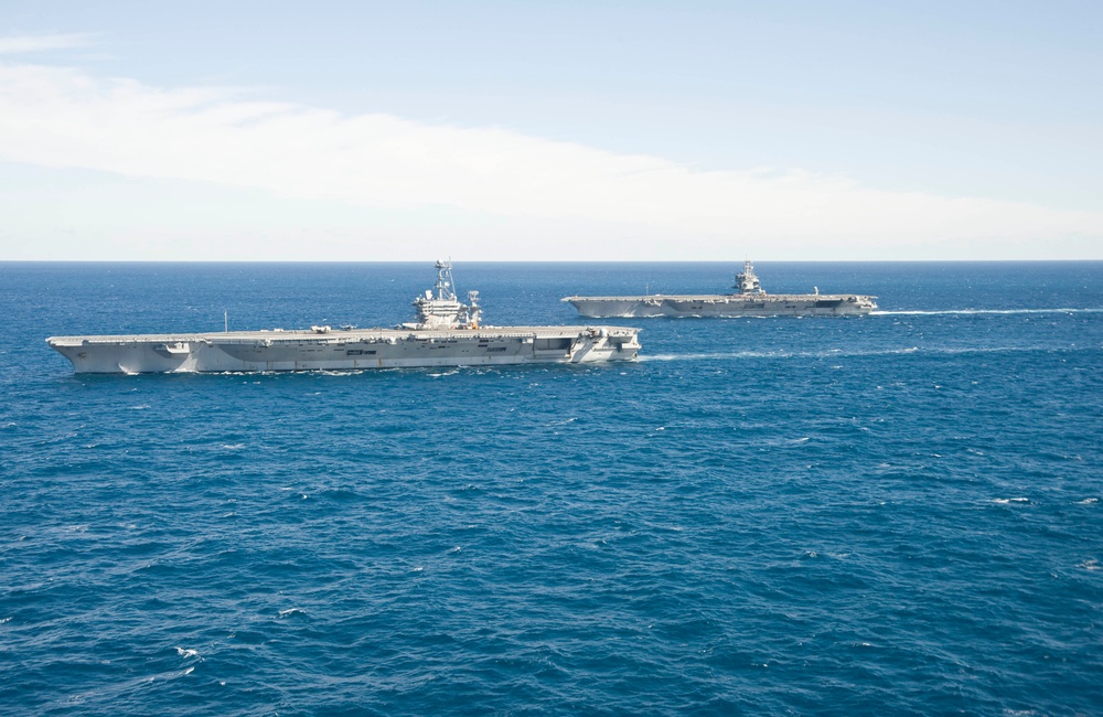 USS Enterprise passes USS Harry S. Truman in the Atlantic