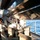 USS Fort McHenry sailor guides boat USS Fort McHenry sailor guides boat