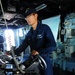 USS McFaul sailor mans the helm