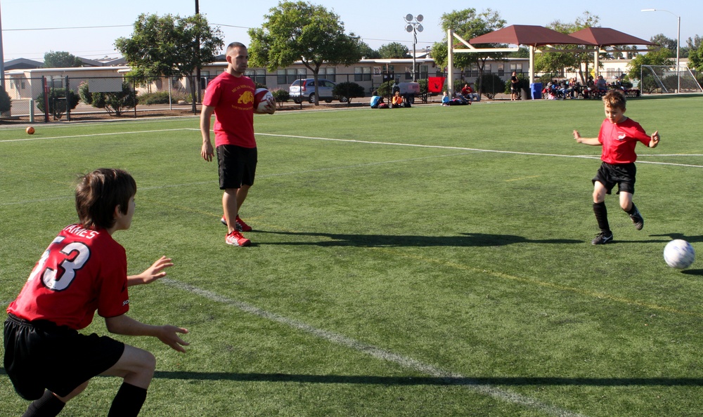 Keeping the ball in their court: Marine coaches teach kids sports, values