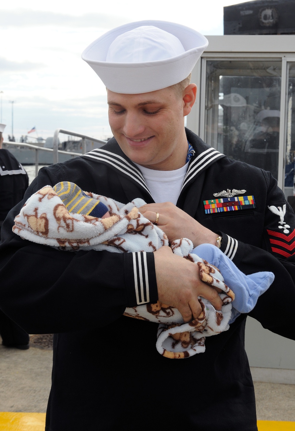 USS Norfolk sailor holds his newborn for first time