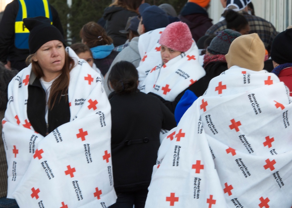 Displaced Civilians Await Aid at Distribution Center.