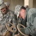 Soldiers Work to clear high school of flooding