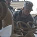 Soldiers work to clear high school of flooding