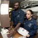 USS Hue City sailors process mail