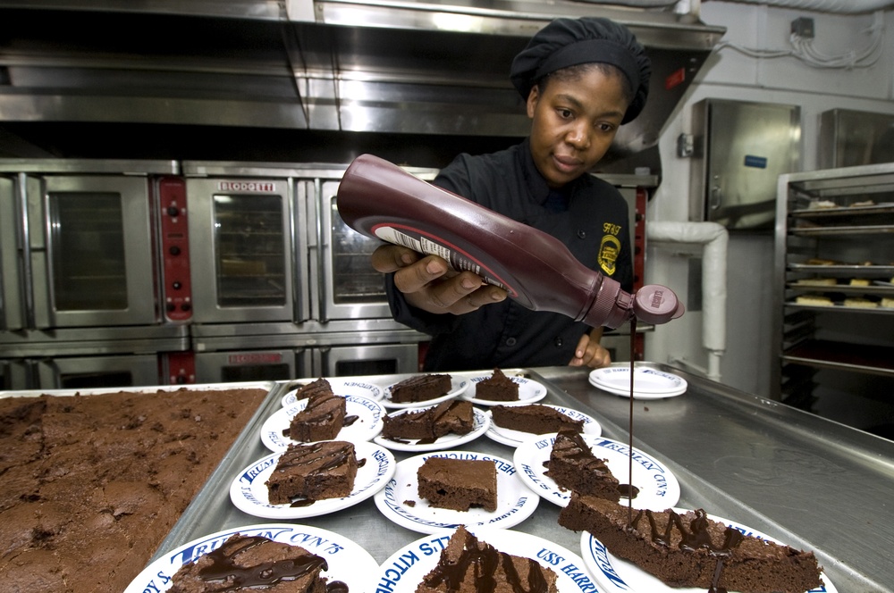 USS Harry S. Truman sailor prepares dessert