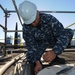 USS Carl Vinson sailor performs maintenance