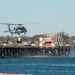 MH-60S Sea Hawk sling loads a power generator