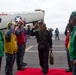 Japanese commander walks through USS George Washington sideboys