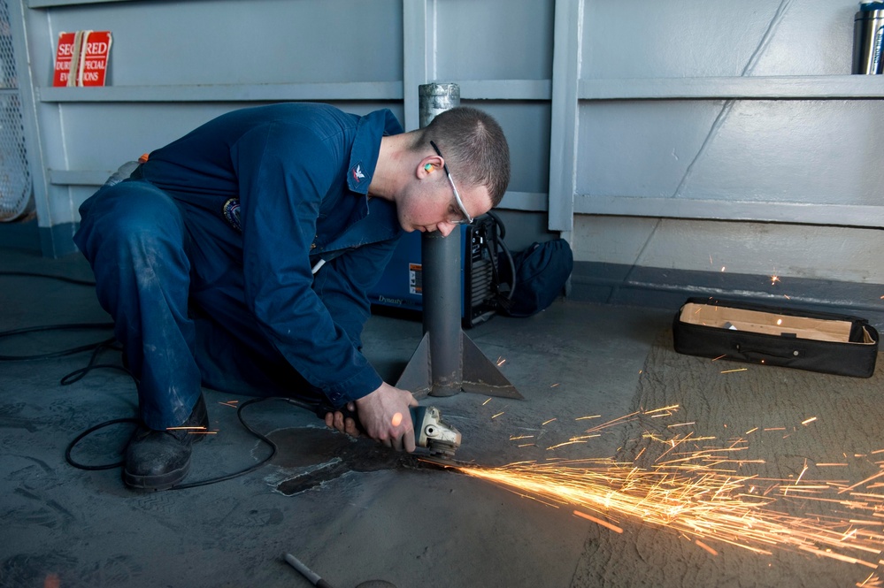 USS John C. Stennis sailors at work