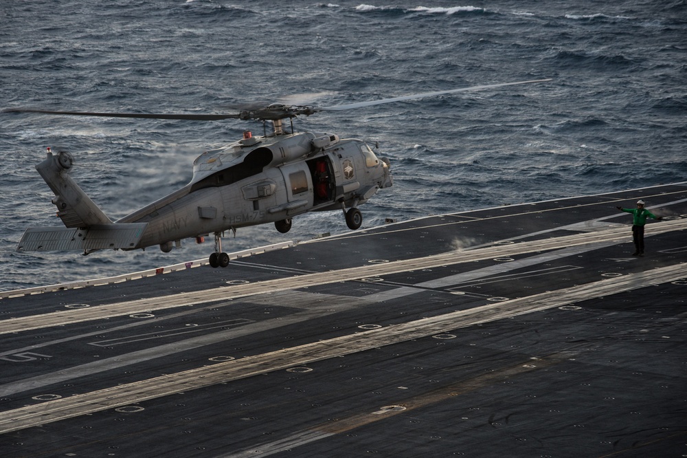 Helicopter lands aboard USS Nimitz