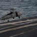Helicopter lands aboard USS Nimitz