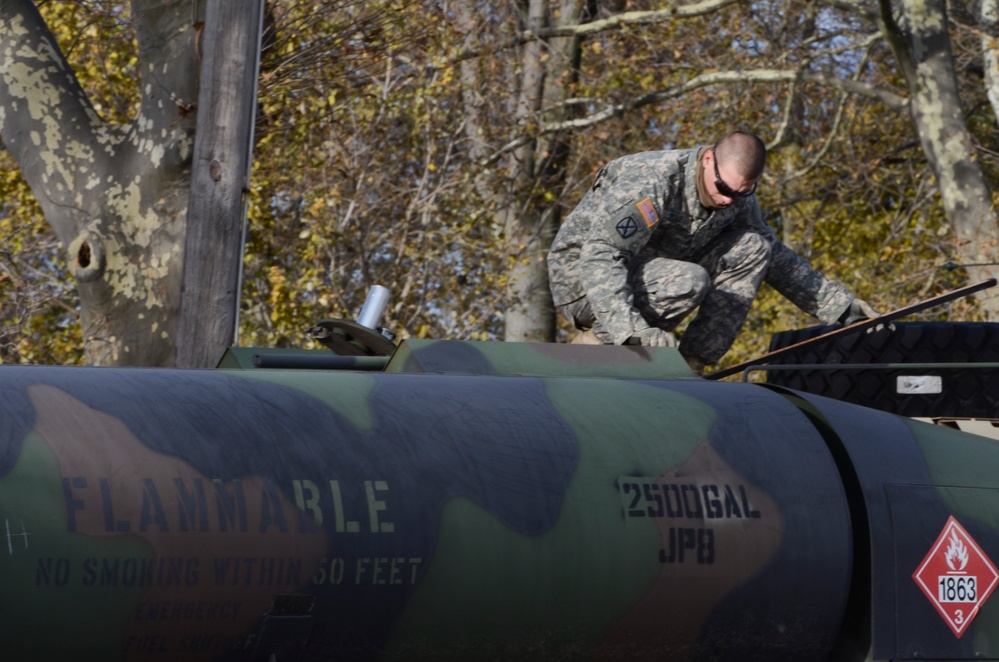 Soldier Checks Fuel Levels