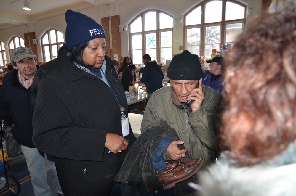 FEMA Community Relations workers help Rockaway, New York, residents apply for federal aid