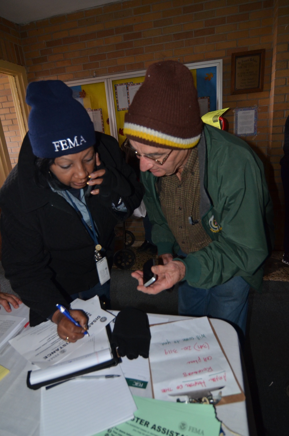 FEMA community relations workers assist residents in Rockaways area of New York City