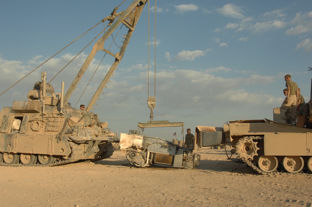 Marines perform tank maintenance