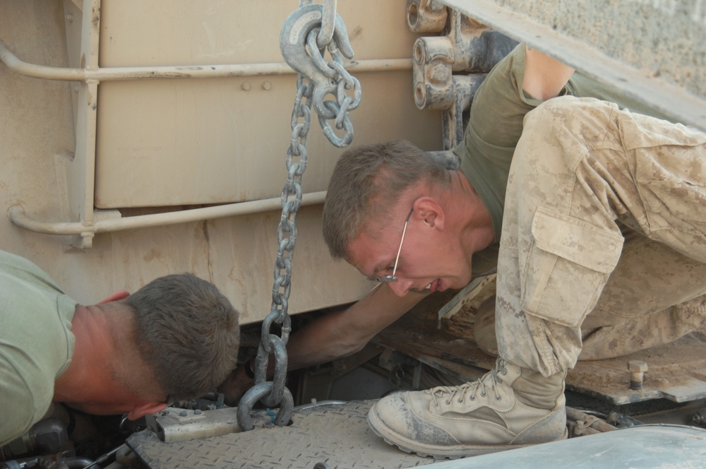 Marines perform tank maintenance
